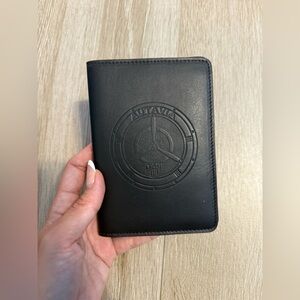 Black Leather (I don’t know if is real leather) Passport Holder
